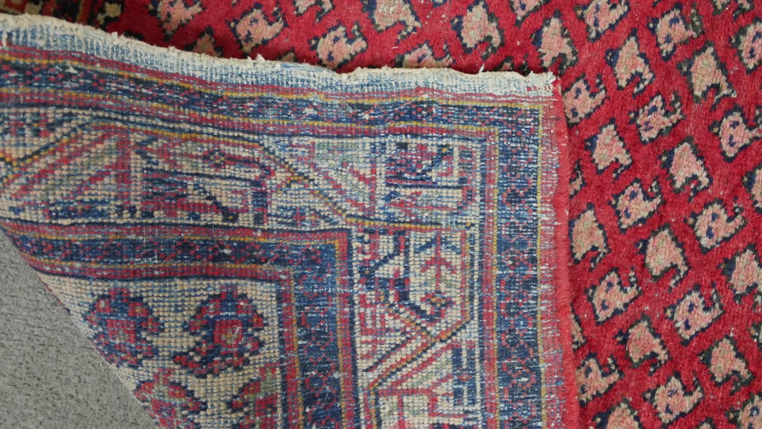 A red ground handmade Persian sarouk rug. L.204 H.130cm - Image 4 of 5