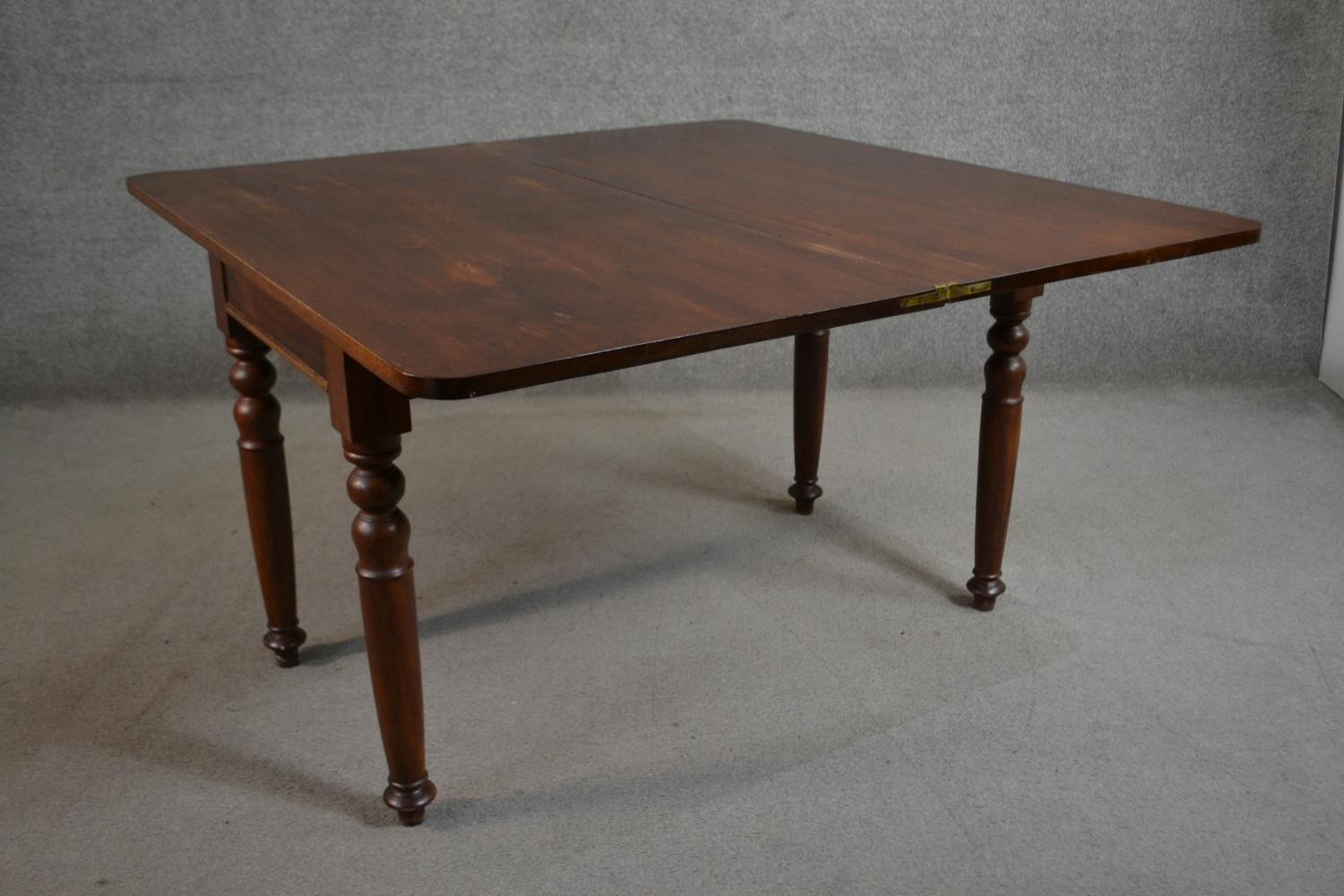 A Victorian walnut tea table of rectangular form with a fold over top on turned legs. H.70 W.116 D. - Image 4 of 6