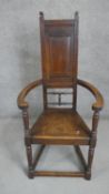 An Arts & Crafts oak Shakespeare chair in the manner of E W Godwin, probably retailed by Liberty &