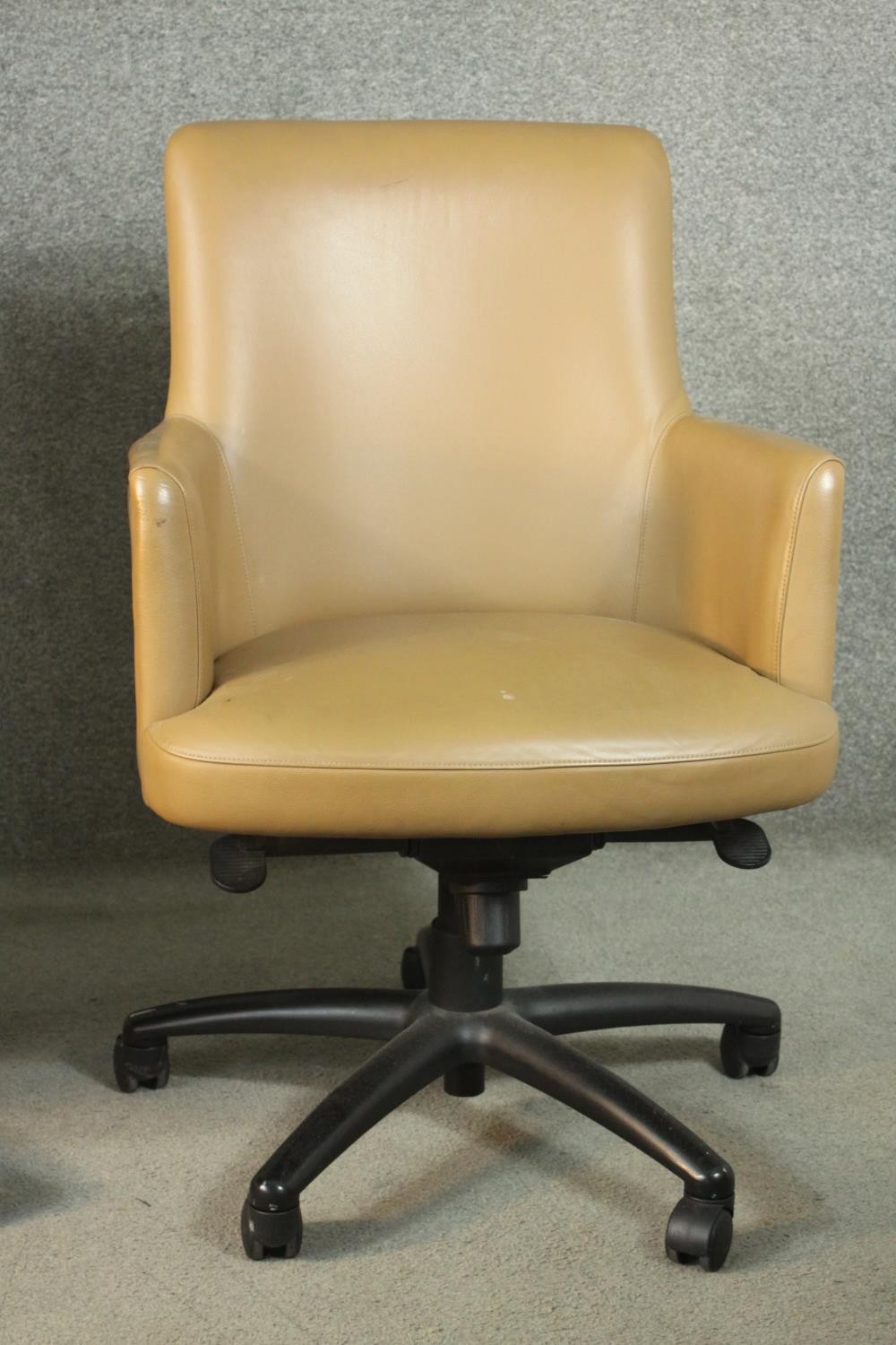 A pair of late 20th century tan leather swivel office chairs, of tub form, with a five point base on - Image 4 of 9