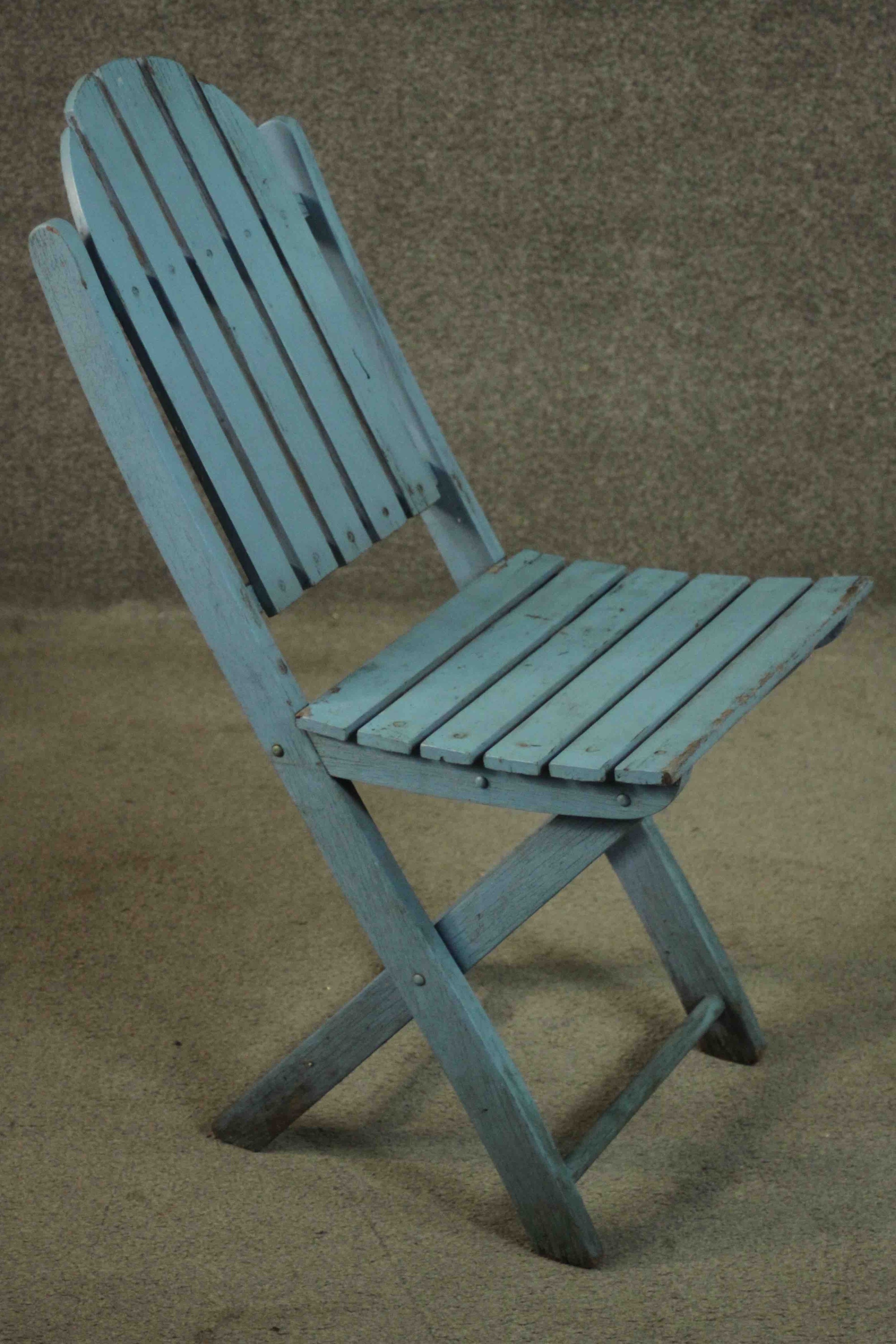 A set of four blue painted folding garden chairs with slatted backs and seats. - Image 3 of 7