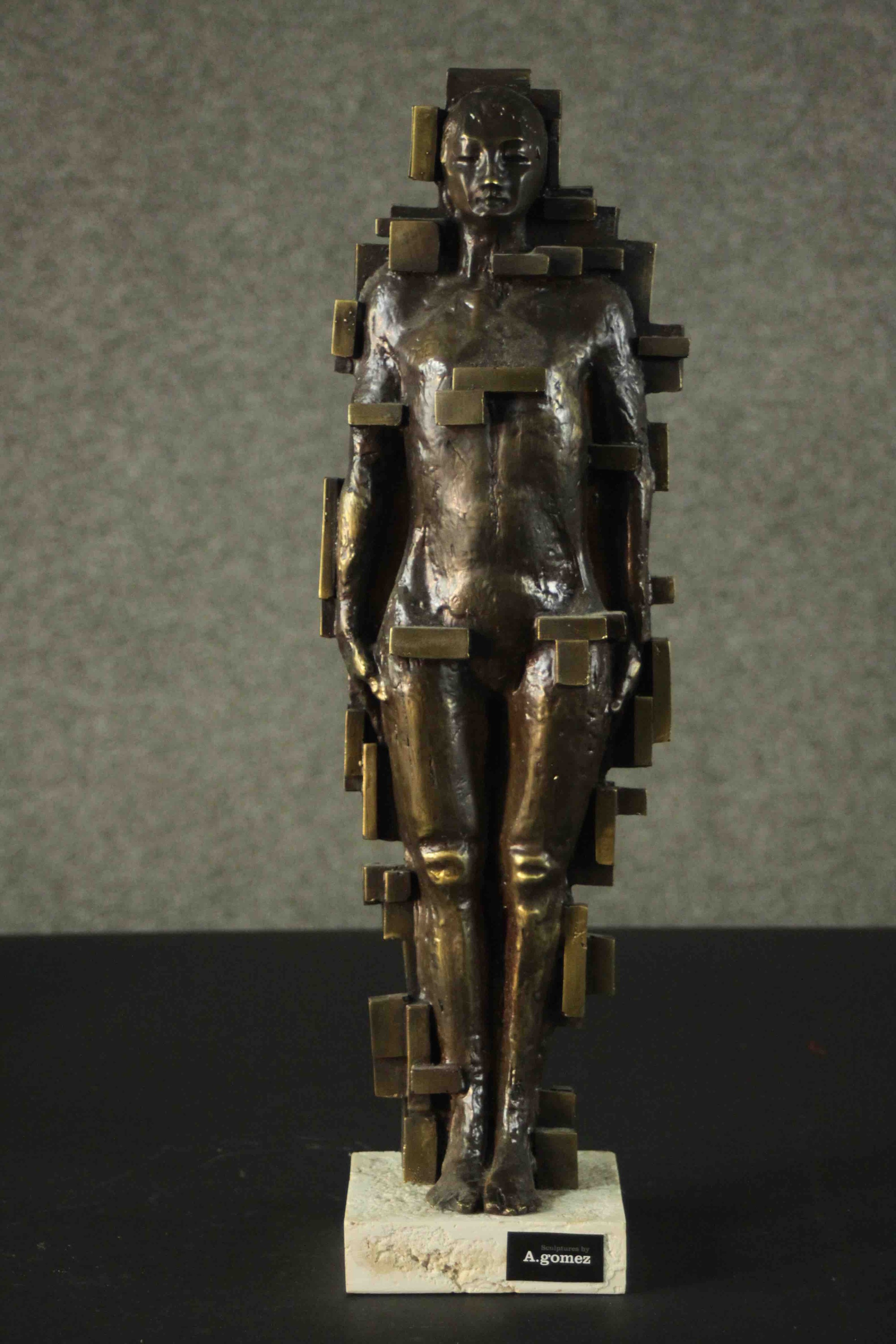 A. Gomez bronze effect brass Brutalist female figure, mounted on a marble base. H.50 W.11.5 D.11.