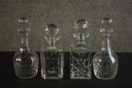 A pair of late 19th century cut glass decanters and two later hand cut crystal decanters, each