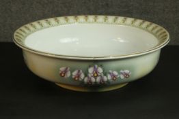 A Keeling & Co Ltd Staffordshire Woodstock pattern wash bowl, decorated with orchids. H.12 Dia.42cm.