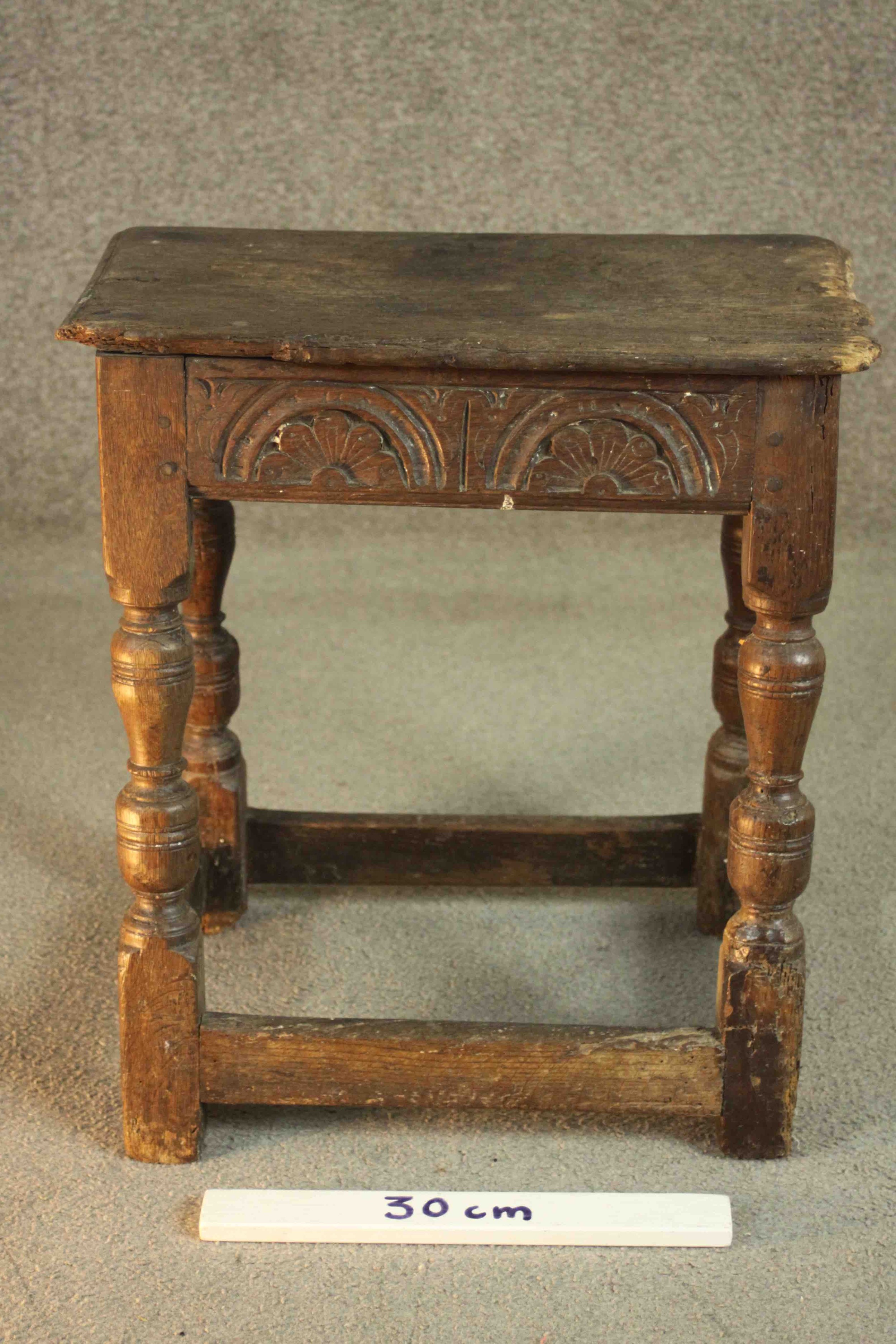 A 17th century and later oak joynt stool, the rectangular seat with a moulded edge over a carved - Image 2 of 7