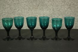 A set of six Victorian hand blown Bristol green stemmed glasses. (odd) H.13 Did.7cm. (largest)