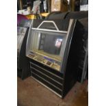 Rowe Ami 100 CD jukebox holding 100 CD's. U.S import. Complete but untested. It may be possible