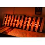 Pop Memorabila: Original neon Blondie sign mounted on black and white parallel wooden boards. Used