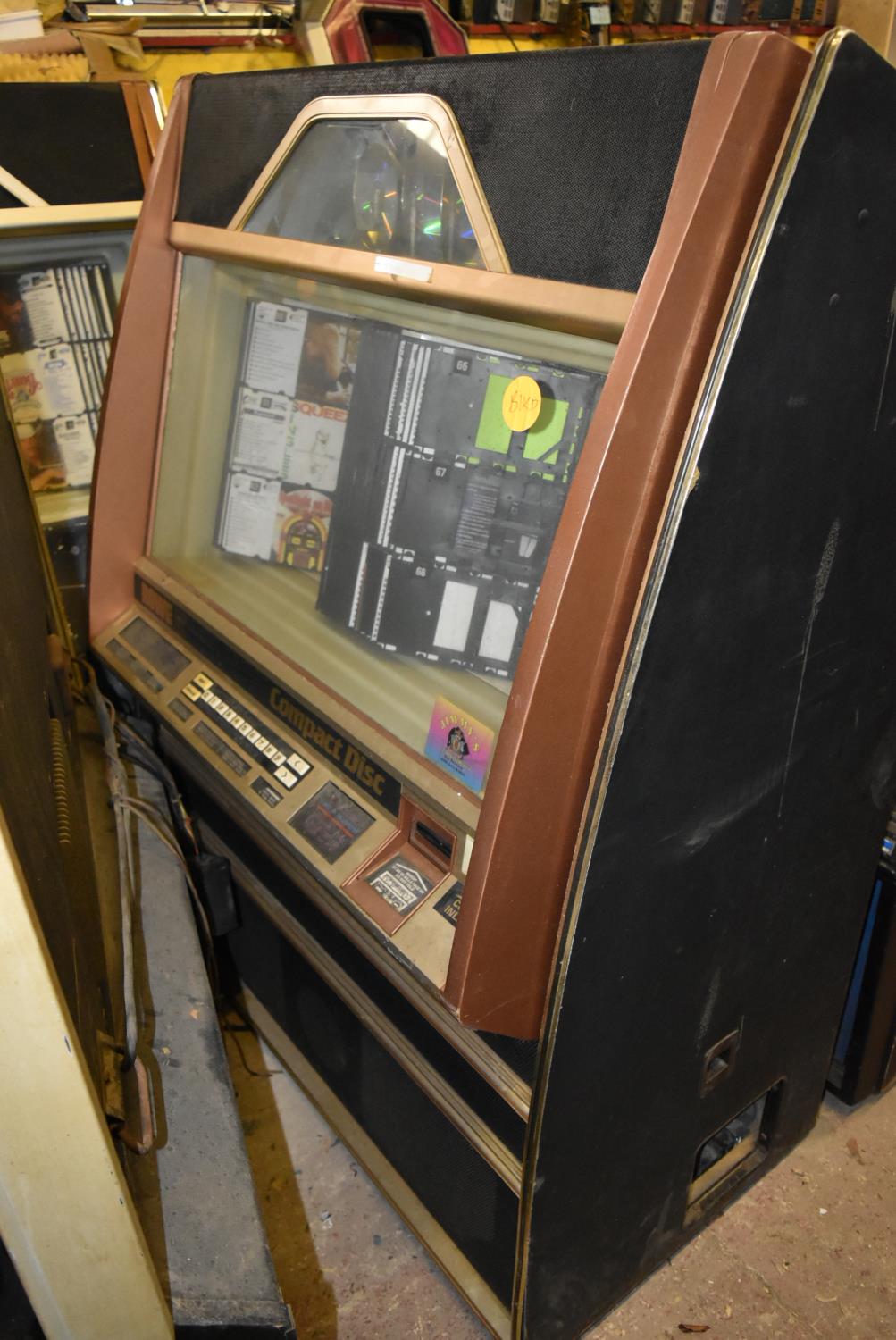 Rowe Ami 100 CD jukebox holding 100 CD's. U.S import. Complete but untested. It may be possible