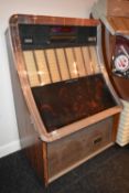 1980's NSM Prestige vinyl jukebox. Holds 80 7" records. Complete but untested. It may be possible