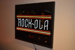 LED Rock Ola sign with power transformer and remote control. Boxed, tested and working. There are