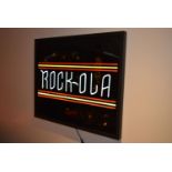 LED Rock Ola sign with power transformer and remote control. Boxed, tested and working. There are