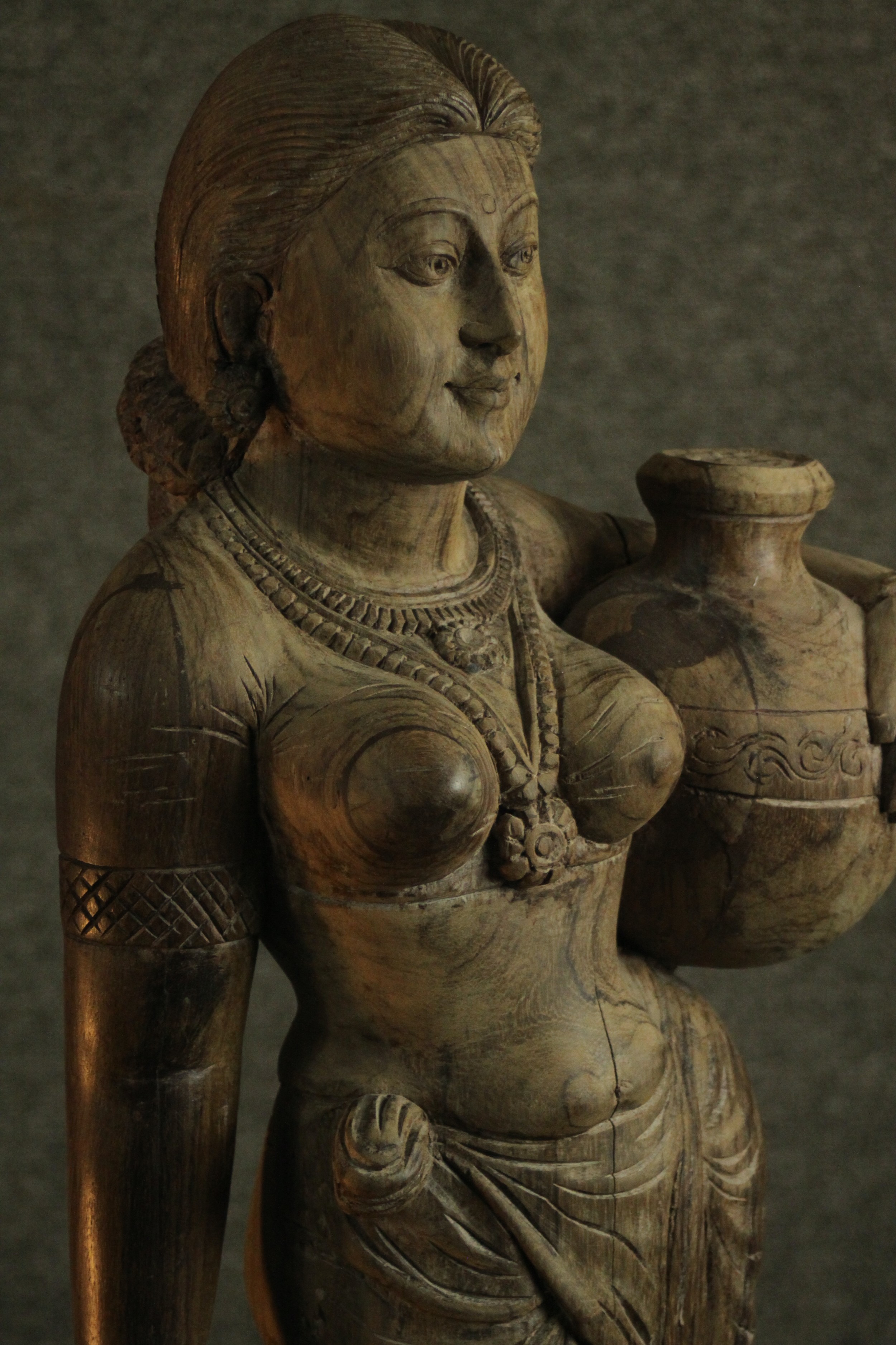 A 20th century carved figure of a woman holding her child's hand and carrying a water vessel. H.78 - Image 4 of 10