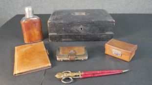 A leather and brass travelling writing box and slope, a leather and silver wallet, a leather