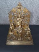 A 19th century Indian brass shrine with four removable brass deities. H.36 W.29 D.31cm.