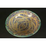 A large early 20th century Moroccan interlocking ring pattern hand painted ceramic bowl. H.13 Dia.