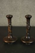 A pair of Japanese Meji period bronze gourd form candlesticks. Each with a relief dragon wrapped