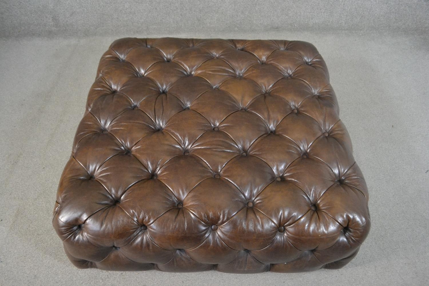 A contemporary brown deep buttoned leather hearth stool. H.33 W.100 D.100cm - Image 3 of 4
