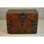 A 19th century Korean elm Bandaji chest, with a fold over front, iron handles, lock and banding. H.