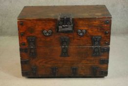 A 19th century Korean elm Bandaji chest, with a fold over front, iron handles, lock and banding. H.