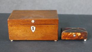 A 19th century mahogany tea caddy along with a Georgian tortoiseshell sarcophagus form box. H.5.5