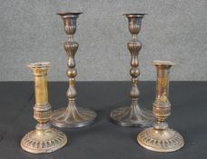 Two pairs of 19th century repousse design candle sticks. H.29 Diam.14cm (largest)