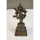 A 19th century bronze figure of Rama mounted on a lotus form and square base. H.24 W.9 D.9cm.