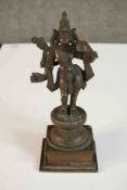 A 19th century bronze figure of Rama mounted on a lotus form and square base. H.24 W.9 D.9cm.