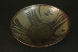 A large 20th century green stoneware glaze bowl with brown painted design. H.11 Dia.39.4cm.