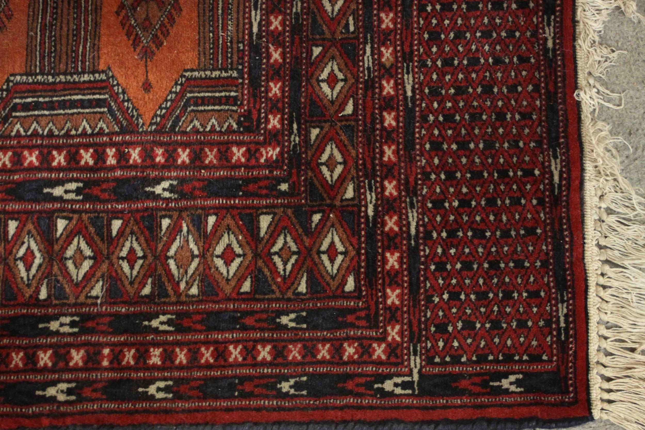 A Pakistan Bokhara rug with repeating pole medallions within multiple borders. L.126 W.80cm. - Image 4 of 5