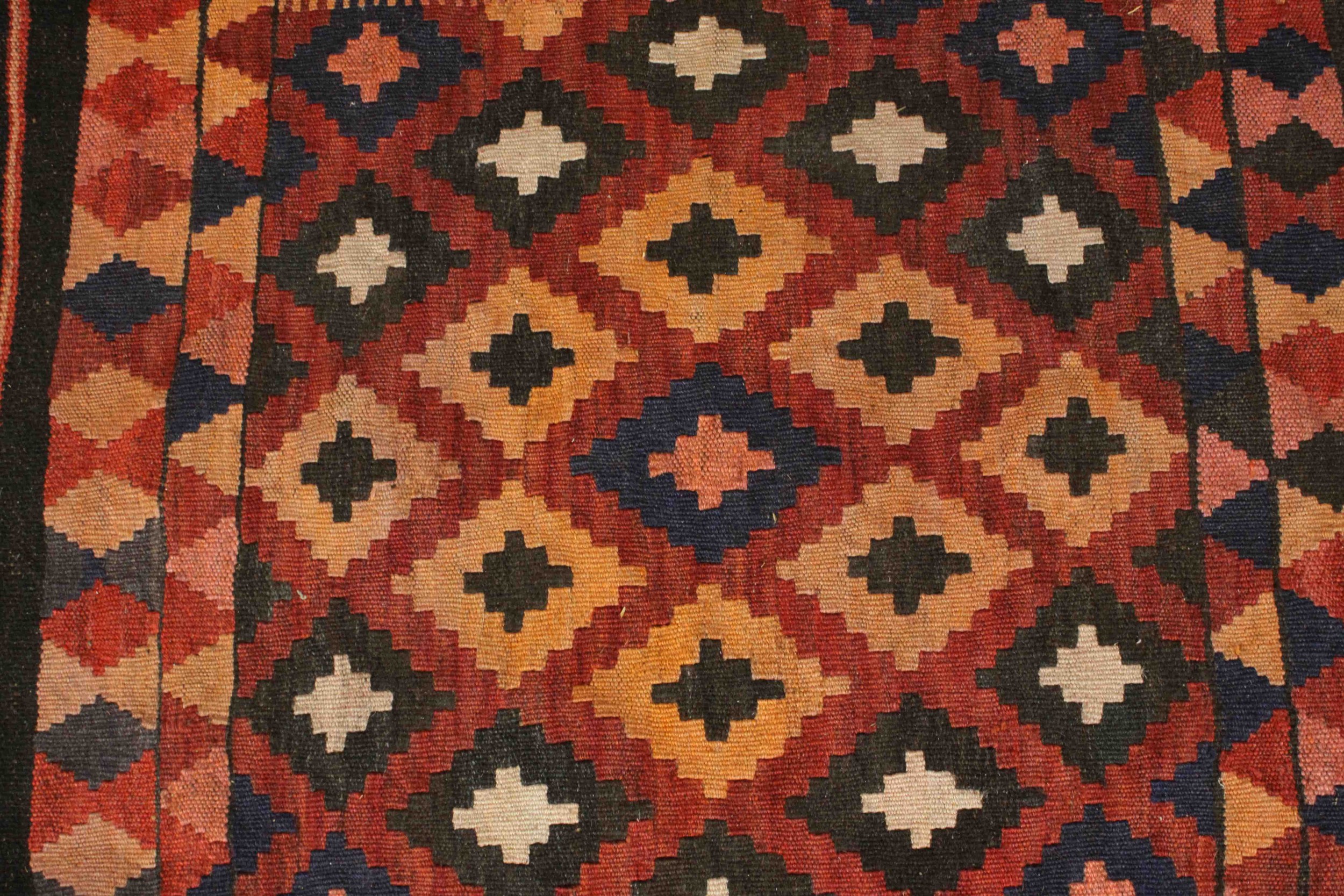 An Afghan Kelim rug with repeating diamond motif on a terracotta ground. L.94 W.69cm. - Image 3 of 5