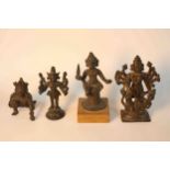 Four early 20th century bronze figures of Asian deities, one in a crouched position. H.14 W.6.5 D.
