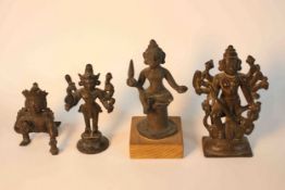 Four early 20th century bronze figures of Asian deities, one in a crouched position. H.14 W.6.5 D.