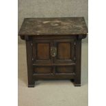A C.1900 Korean elm table top cabinet with panel doors on block feet. H.61 W.67 D.55cm.