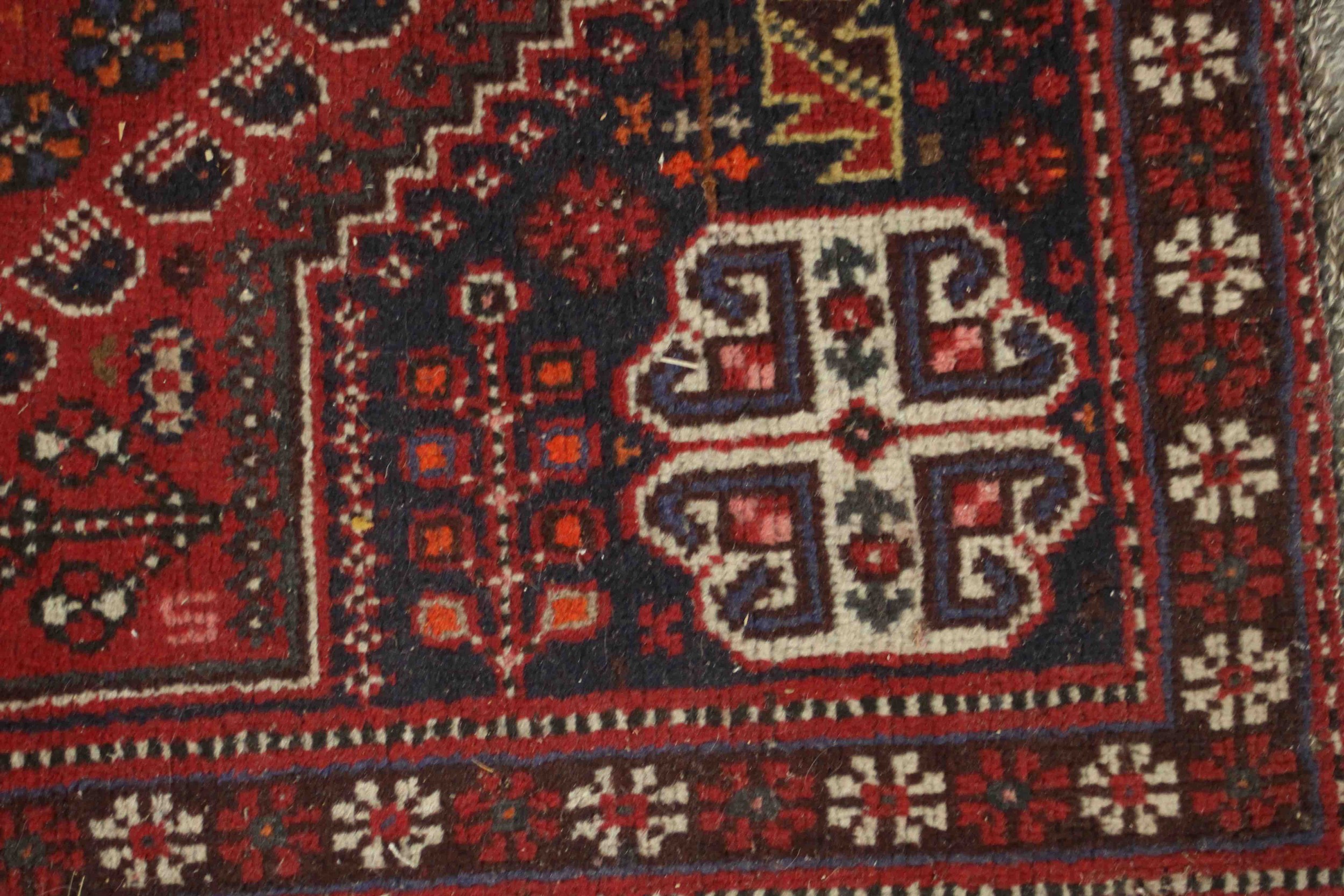 A Persian Shiraz the central medallion with stylised floral motifs on a burgundy ground within - Image 4 of 5