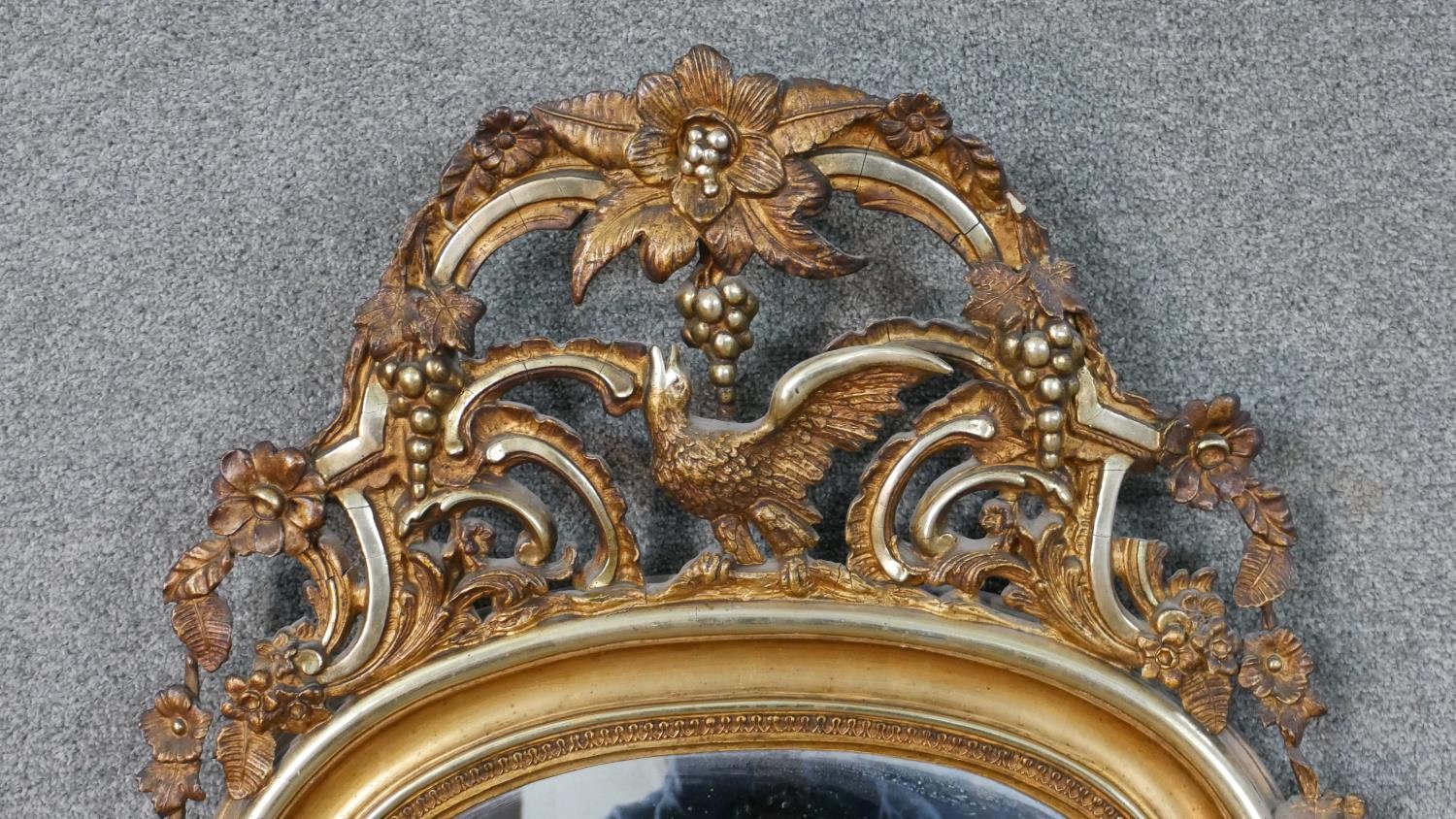 A large early 20th century carved giltwood arched wall mirror. The top with a pierced grape, bird - Image 3 of 8