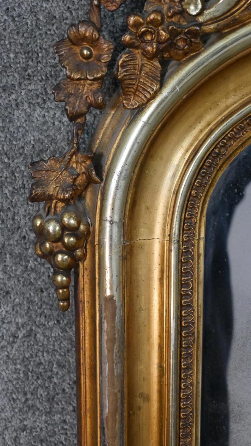 A large early 20th century carved giltwood arched wall mirror. The top with a pierced grape, bird - Image 6 of 8