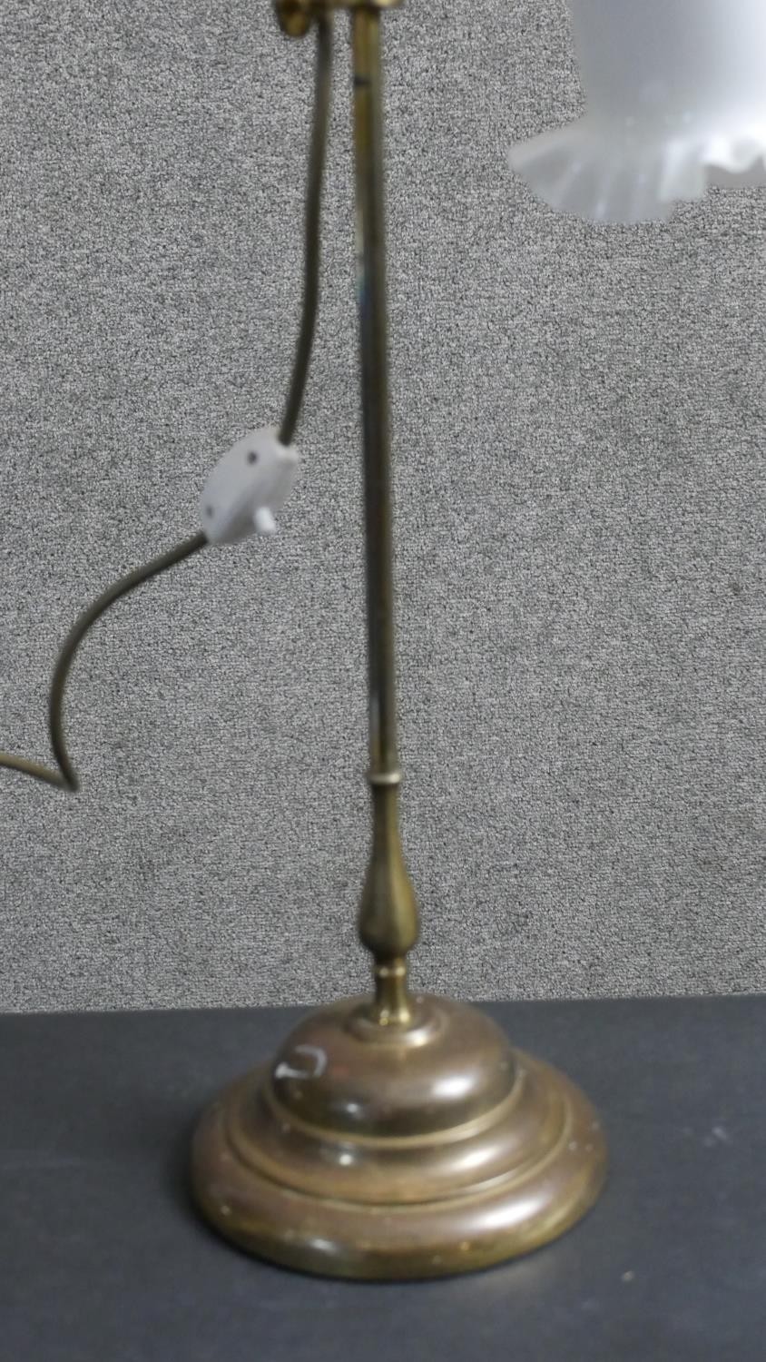 An early 20th century brass student's lamp with handle on a moulded circular base. The bell form - Image 5 of 6