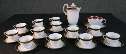 A collection of hand painted porcelain, including a set of twelve hand painted black and gold