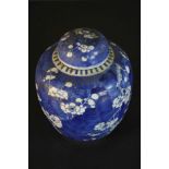 A 19th century Chinese lidded blue and white hand painted porcelain prunus blossom design ginger