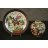 A 20th century Chinese hand painted crackle glaze ceramic ginger jar and plate. Each painted with