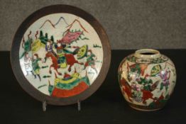 A 20th century Chinese hand painted crackle glaze ceramic ginger jar and plate. Each painted with