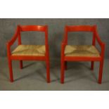 Vico Magistretti for Cassini, Italy, a pair of Carimate red lacquered beech open armchairs, circa