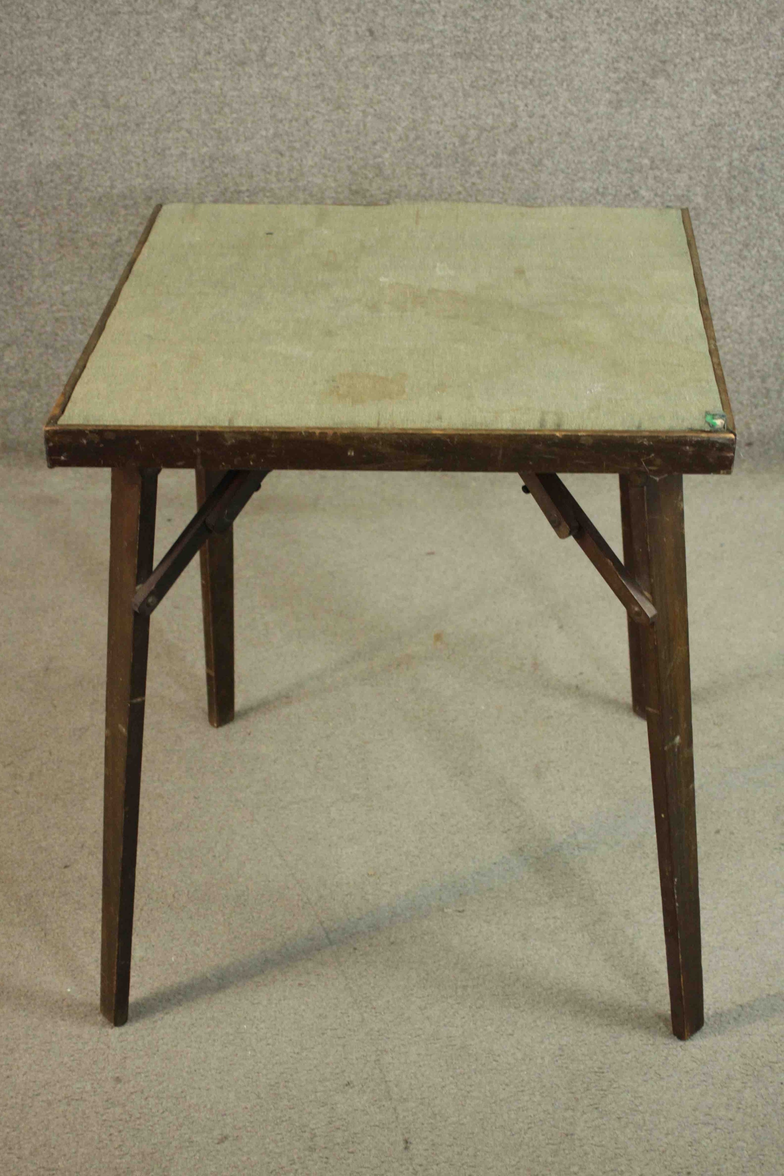 A vintage folding card table with makers label to the underside. H.71 W.62 D.62cm.