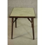 A vintage folding card table with makers label to the underside. H.71 W.62 D.62cm.