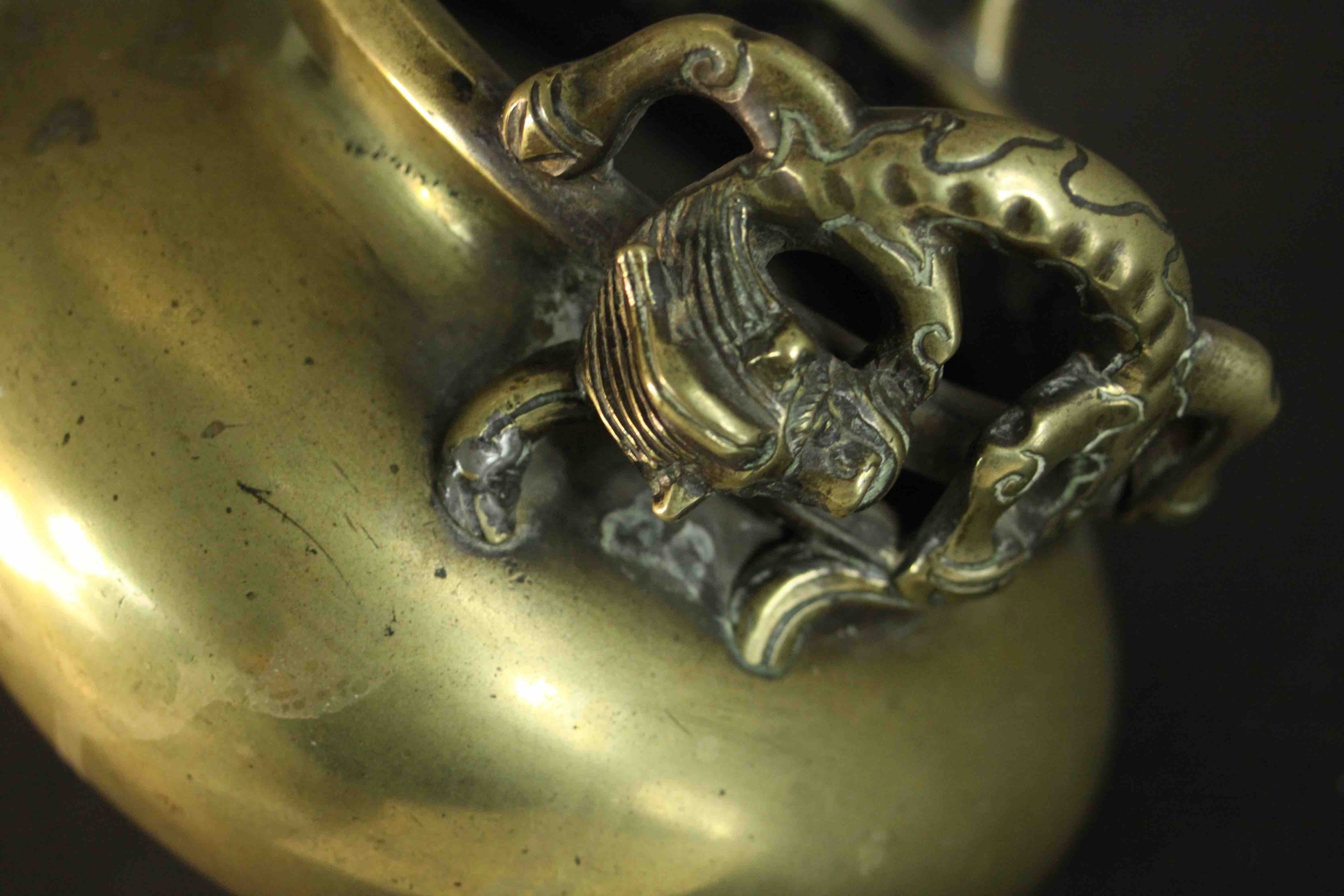 A three footed Chinese brass censer with dragon form handles. Apocryphal Ming Chenghua mark to base. - Image 5 of 6