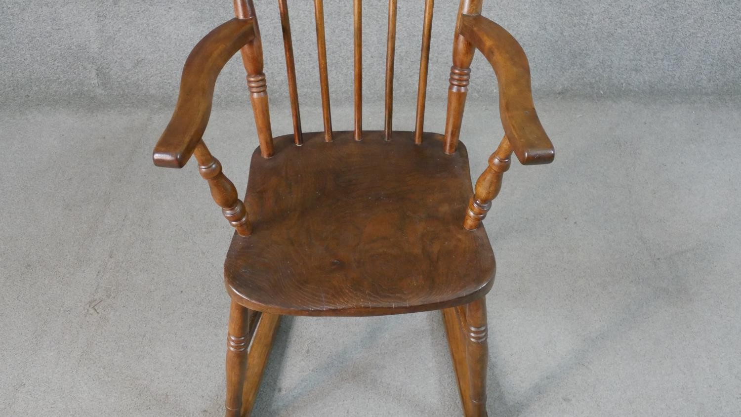 A 19th century style comb back rocking chair, with an elm seat, on turned legs joined by stretchers. - Image 3 of 4