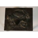 An early 20th century Japanese bronze of a miniature table laid with a tetsubin and a variety of