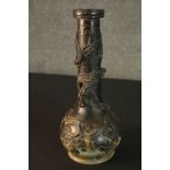 A 19th century Japanese bronze gourd shaped vase with relief dragon and a phoenix in a blossom