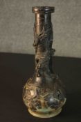 A 19th century Japanese bronze gourd shaped vase with relief dragon and a phoenix in a blossom